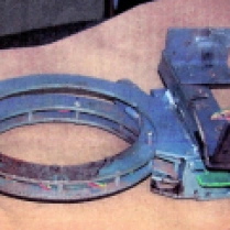 The metal collar that held the bomb to Brian Wells was intact after the explosion; it operated like a large handcuff that was locked to his neck. The metal box that held the bomb mechanism was attached to the frame of the collar. RICH FORSGREN/ERIE TIMES NEWS, via FBI