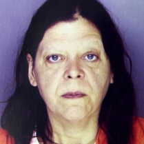 Marjorie Diehl-Armstrong, in the mug shot Erie police took of her after she was arrested in the shooting death of her live-in boyfriend Jim Roden, whose body was found in a freezer on September 21, 2003. Nearly four years later, a federal grand jury would indict her in the Brian Wells pizza bomber case and allege she killed Roden to keep him quiet about the bank-robbery plot in which Wells participated. ERIE TIMES-NEWS, via ERIE BUREAU OF POLICE