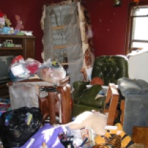 Piles of junk and rotting food greeted Erie police officers and FBI agents when they searched Marjorie Diehl-Armstrong’s house after September 21, 2003. They were looking for evidence that she fatally shot her boyfriend Jim Roden and helped place his body in a freezer in Bill Rothstein’s garage. Diehl-Armstrong had history of hoarding government-surplus food. "I’ve dealt with corpses with the flesh falling off. This is worse," a veteran Erie police officer said of Diehl-Armstrong’s house. FBI photo, used as evidence at trial