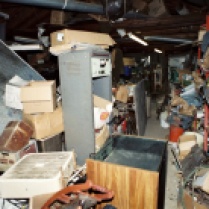 Bill Rothstein’s house was just as filthy and messy as Diehl-Armstrong’s. In his garage, where he had been storing Jim Roden’s body in a freezer, Rothstein also kept the bloody mattress (at left) on which Roden had died at Diehl-Armstrong’s house. FBI photo, entered into evidence at trial
