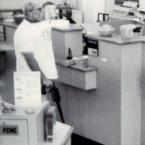 Brian Wells stands at the front counter of the PNC Bank in the Summit Towne Centre, waiting for the chief teller to give him money on August 28, 2003. He had asked for $250,000, an extraordinary amount for a bank robbery. RICH FORSGREN/ERIE TIMES-NEWS, via FBI